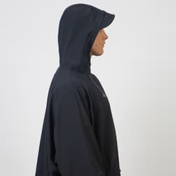 Fourth Element Storm Poncho Lifestyle on Woman Profile - Black Thumbnail}