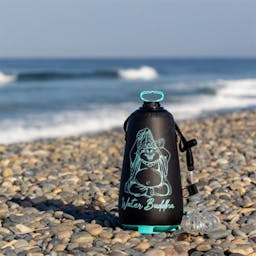 JBL Water Buddha Portable Shower Lifestyle on Beach Thumbnail}